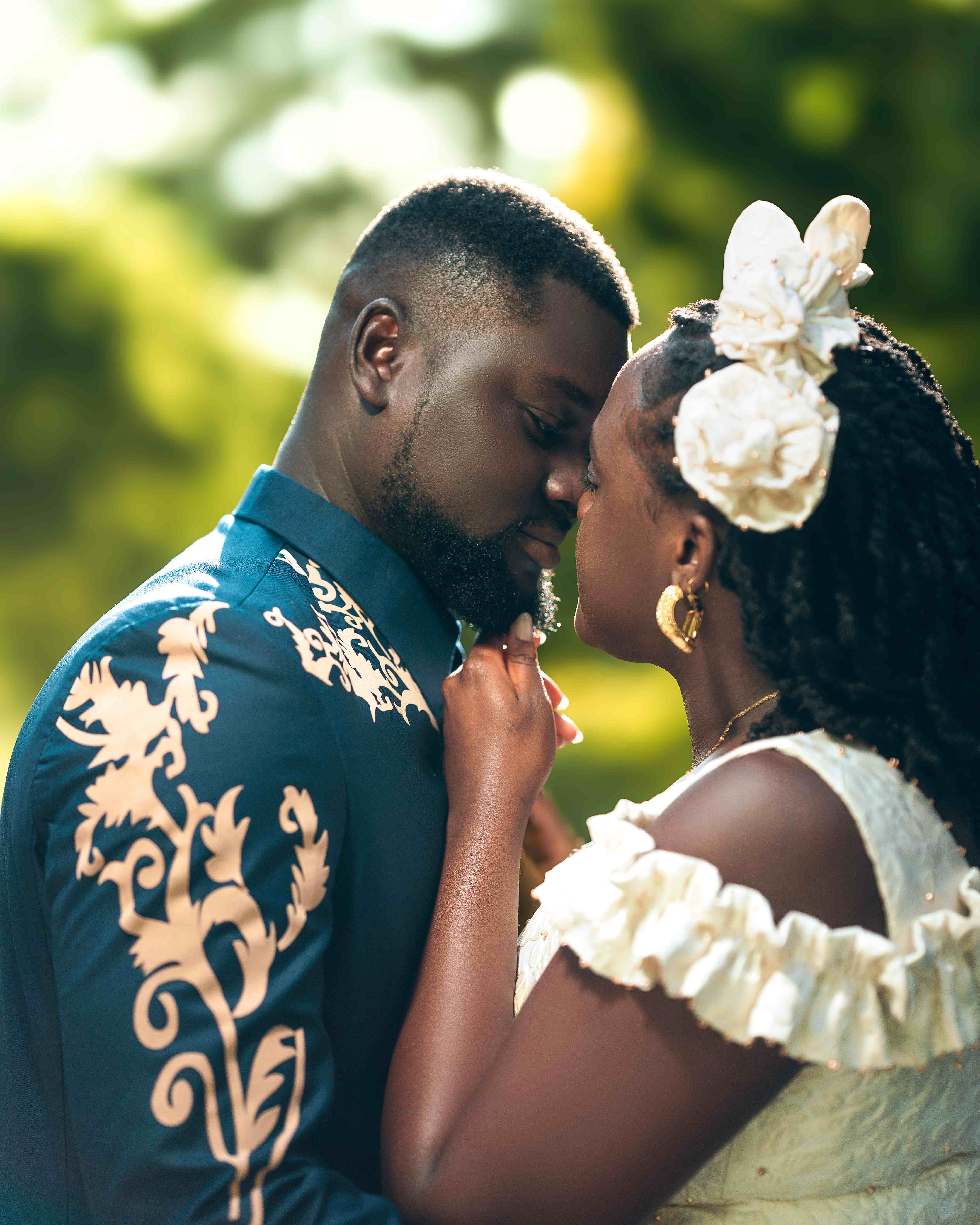Intimate moment between the couple in formal attire